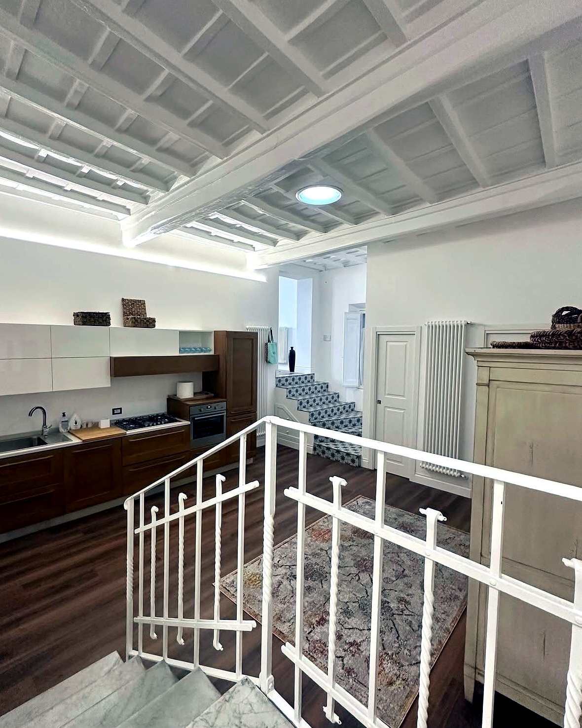 Piazza di Spagna A — kitchen and staircase
